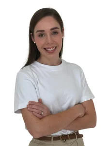 IMG_3966 - Perfect Balance Rehabilitation Centre Smiling woman with arms crossed, wearing a white T‑shirt and beige belt (head and shoulders shown)
